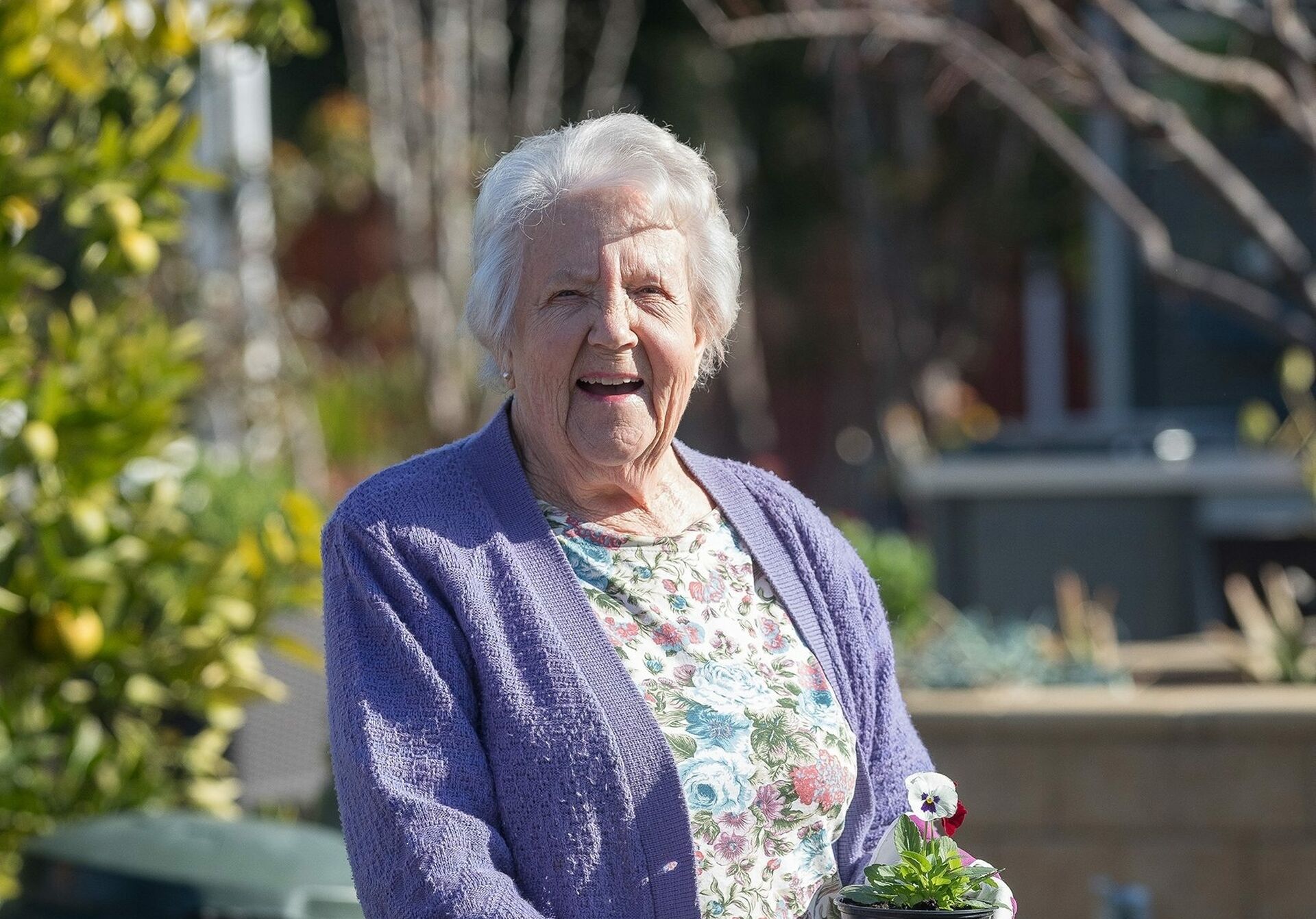 lady laughing near flowers